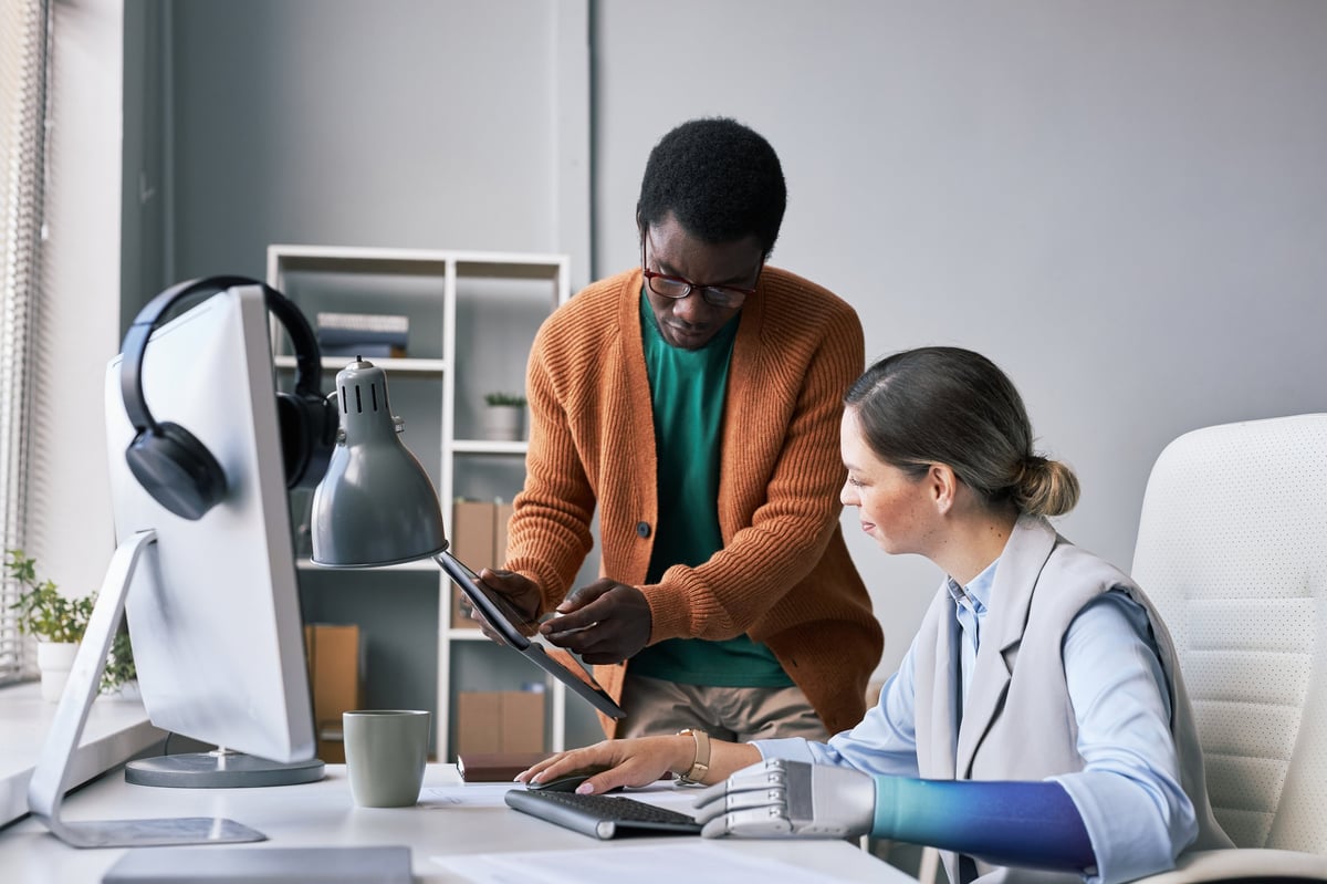 Project manager asking colleague to help him with fixing software bug - Professional disability support services in Canterbury and Inner-West Sydney